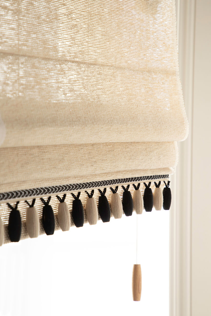 Black and tan beaded fringe by Samuel and Sons tims a handwoven shade by Hartmann&Forbes.