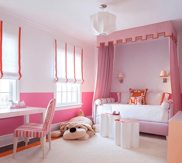 A little girl's dream room is complete with a custom canopy by S.B. Long Interiors. French Grosgrain Ribbon from Samuel & Sons accents pillows and the shape of a pink canopy above. Photography by Neil Landino.