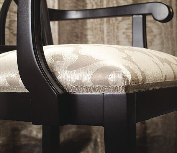 Because details matter, consider a simple upholstery upgrade: Cambridge Strie Braid from Samuel & Sons.