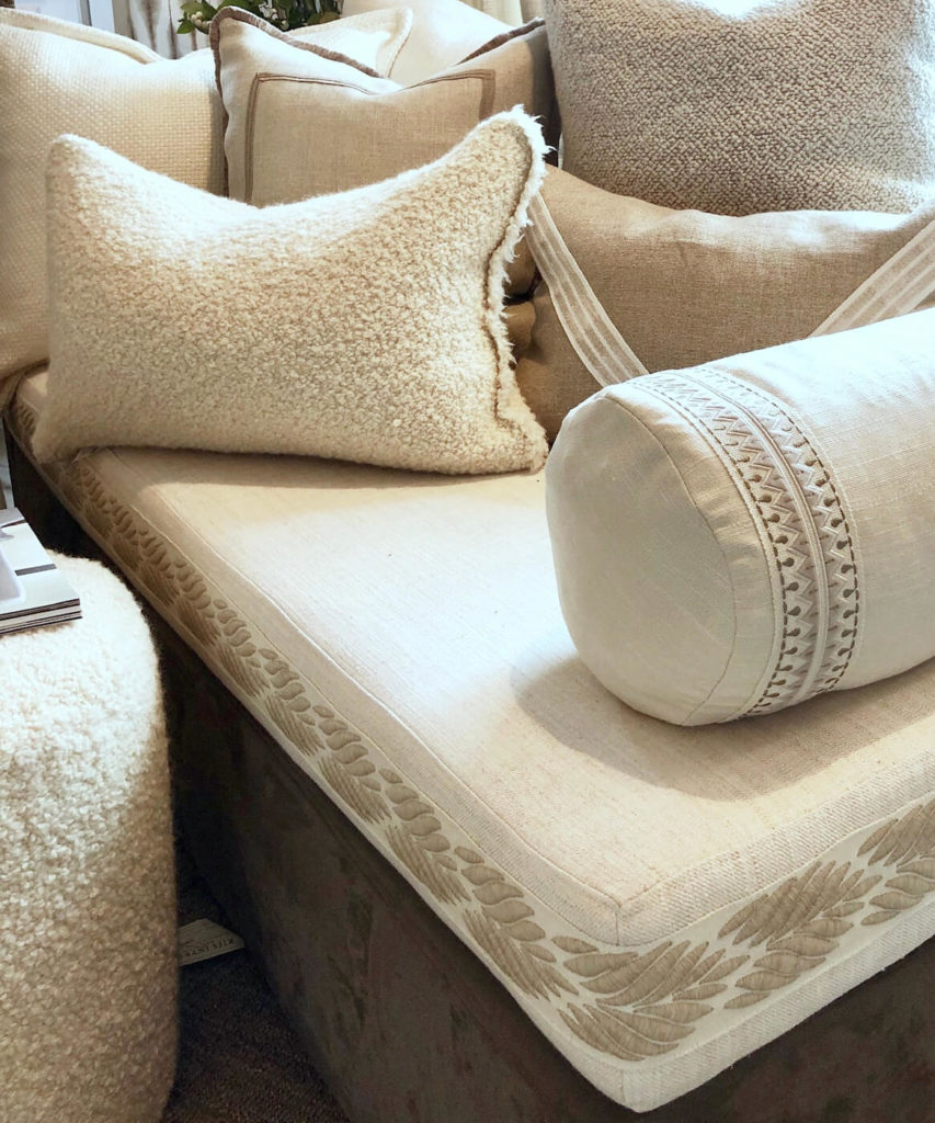 Custom Pillows by Riis Interiors featuring borders and braids by Samuel & Sons.