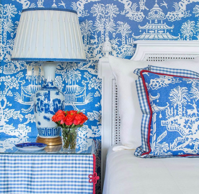 A blue and white bedroom scheme complete with custom lampshade and tableskirt trimmed with Samuel & Sons passementerie.