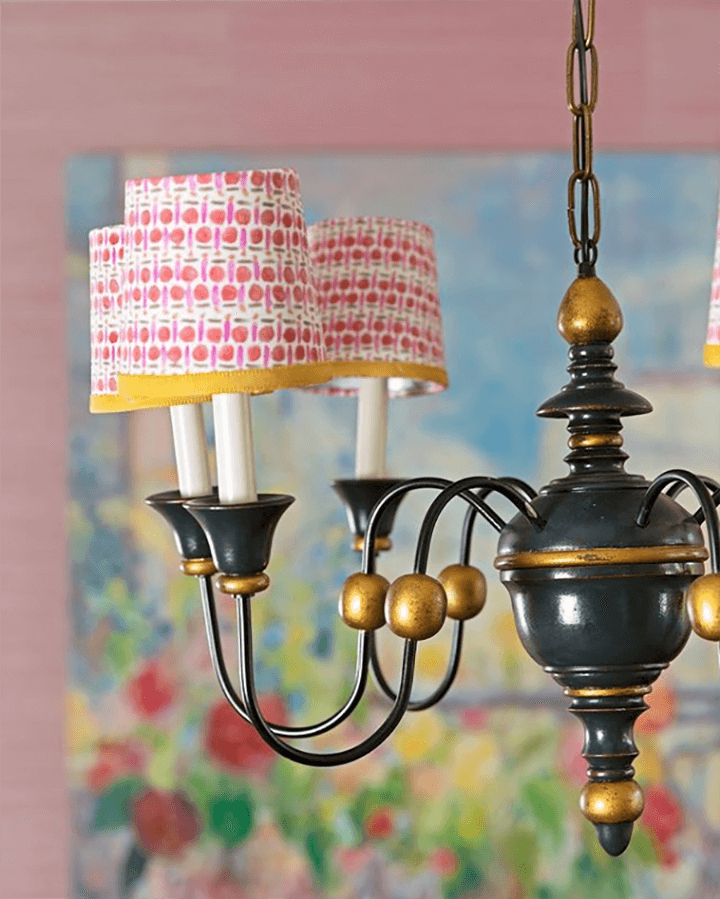 A whimsical chandelier with miniature printed shades.