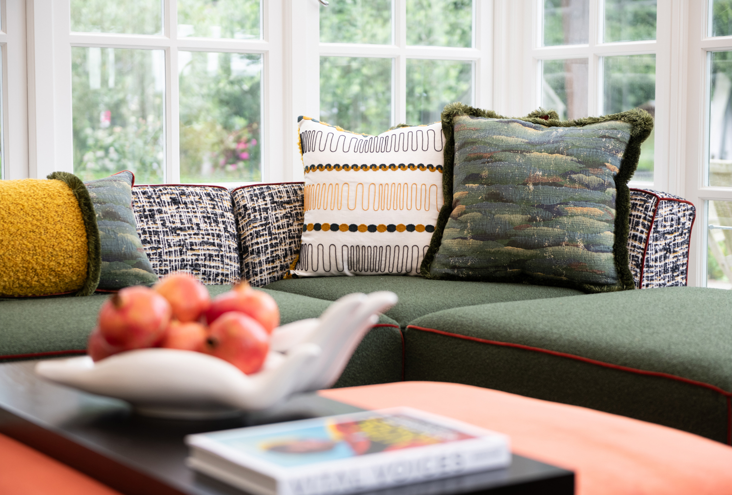 Sectional seating featuring decorative throw pillows.